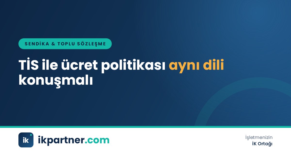 Ücret bantlarını gösteren grafik ve toplu iş sözleşmesi metninin yan yana durduğu masa